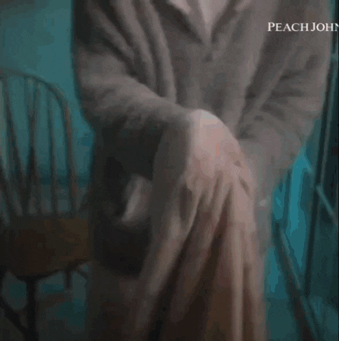a close up of a person 's chest with the word peach john visible
