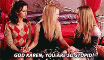 three women are sitting next to each other on a bed and one of them is saying `` god karen , you are so stupid ! ''