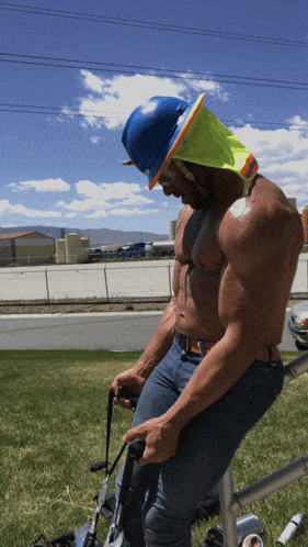 a shirtless construction worker wearing a hard hat and safety vest