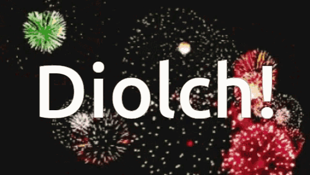 the word diolch is surrounded by fireworks on a black background
