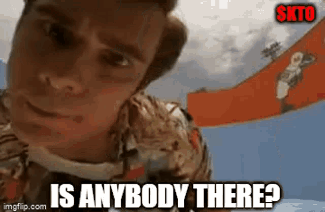 a man in a hawaiian shirt is asking is anybody there .
