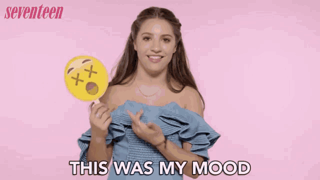 a woman holding a maraca and saying this was my mood