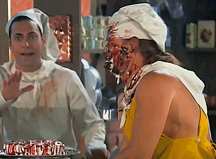 a man in a chef 's hat is standing next to another man