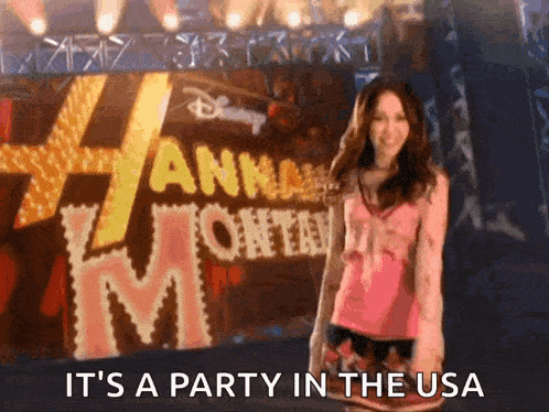 a woman stands in front of a sign that says it 's a party in the usa