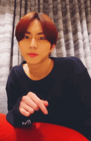 a young man with red hair is wearing a black shirt that says rvca on the sleeve