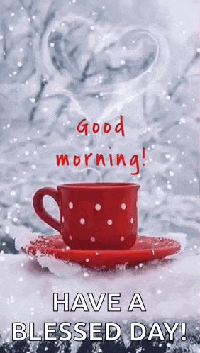 a cup of coffee on a saucer in the snow with a heart shaped steam coming out of it .