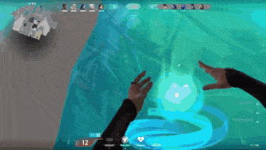 a person 's hands are reaching out towards a blue sphere in a video game .