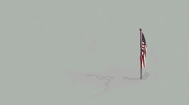 an american flag is flying next to a cloudy hand