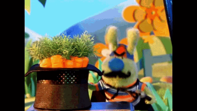 a stuffed bunny with a mustache is standing next to a bowl of carrots in a top hat