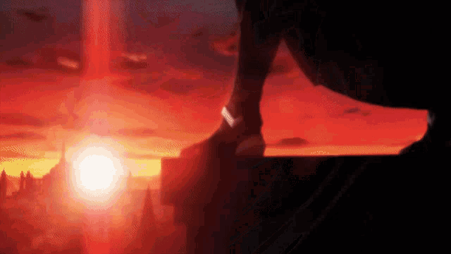 a person is standing on a ledge with the sun shining through the clouds
