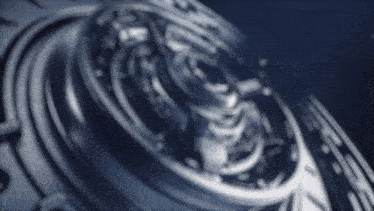 a close up of a metal object with a circular pattern