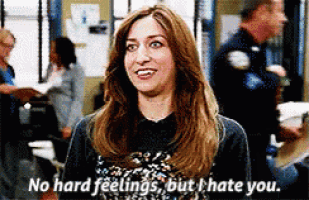 a woman is smiling and says no hard feelings but i hate you