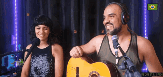 a man and a woman singing into microphones with requests open in the lower right corner