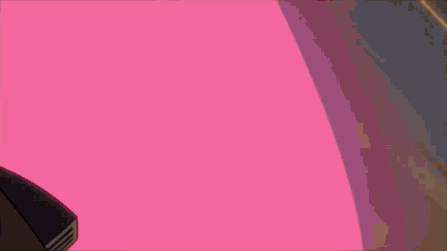 a computer mouse is sitting on a pink table