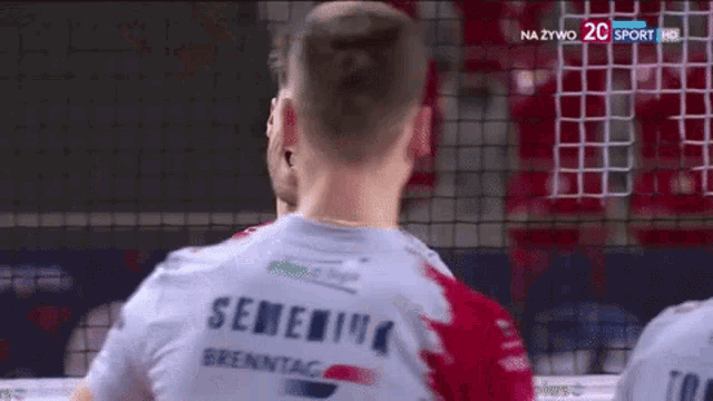 a man wearing a shirt that says semenina brenntag on the back