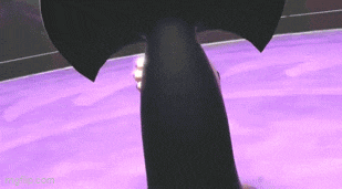 a person is standing on a purple surface in a dark room .