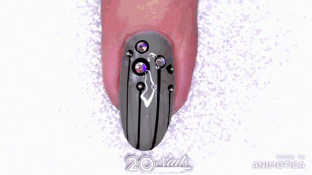 a purple bottle of nail polish is being applied to a pink nail