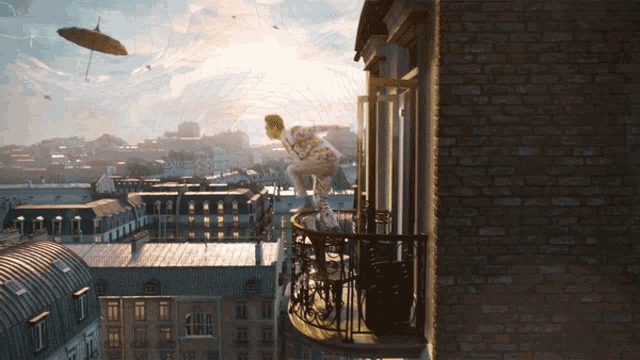 a man stands on a balcony overlooking a city