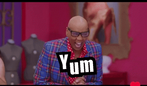 a drag queen is surrounded by two shirtless men with the word yum on the bottom