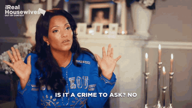a woman says " is it a crime to ask no " in front of candles