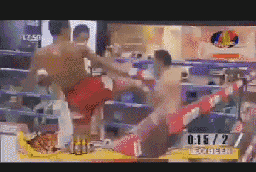 a man kicking another man in a boxing ring that says leo beer at the bottom