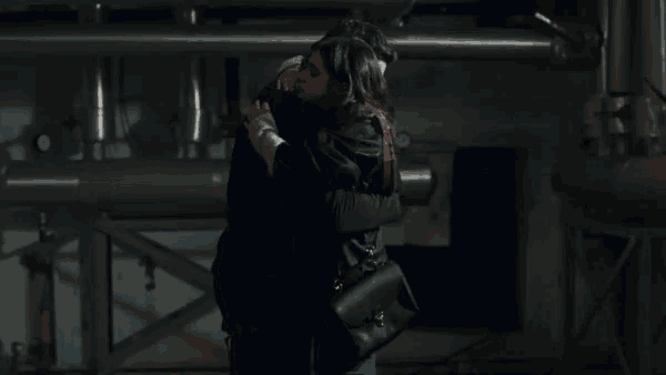 a man and a woman standing next to each other