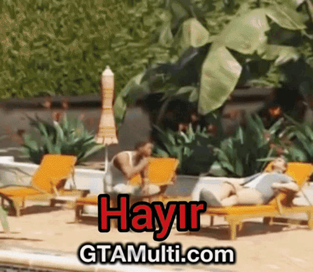 a man sits on a lounge chair next to a pool with hayir written on the bottom right