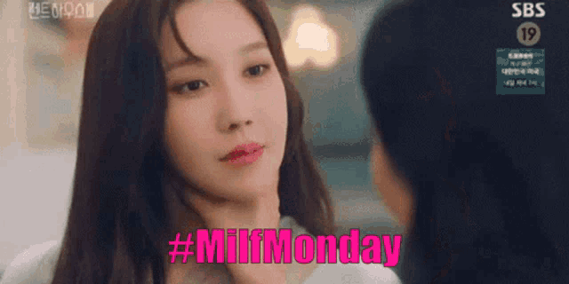 a close up of a woman 's face with the words `` milfmonday '' written in pink .