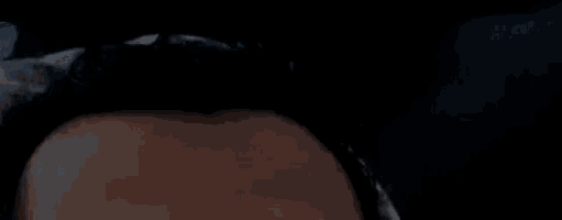 a close up of a person 's forehead in the dark