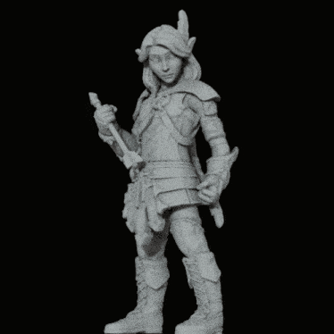 a statue of a woman with horns is holding a spear