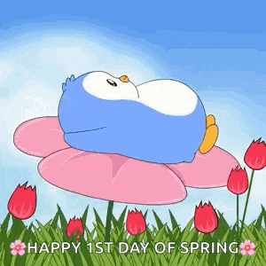 a penguin is laying on top of a pink flower in a field of flowers .