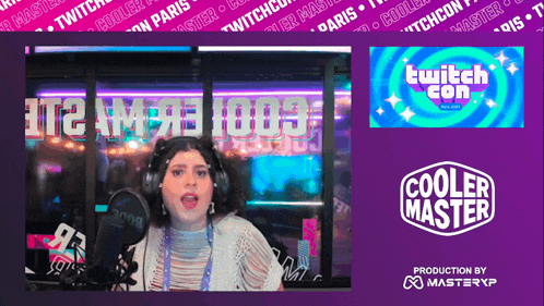 a woman speaking into a microphone with a cooler master logo in the background