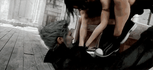 a man and a woman are laying on the floor .