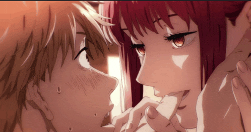 a man and a woman are kissing in an anime