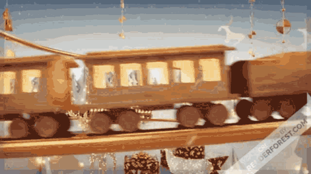 a wooden train with the words renderforest.com on the bottom right