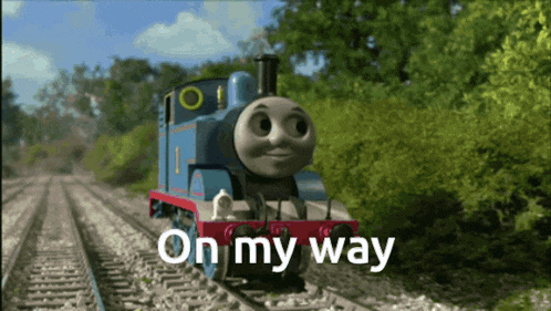 thomas the train is on the tracks with the words on my way above him