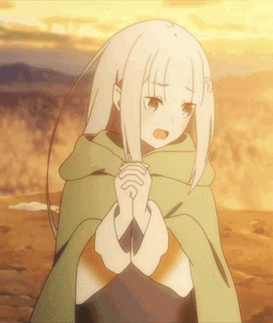 a girl with white hair wearing a green cape