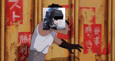 a man with a picture of a girl on his face stands in front of a wall with chinese writing on it