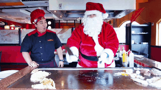 a man dressed as santa claus is cooking food