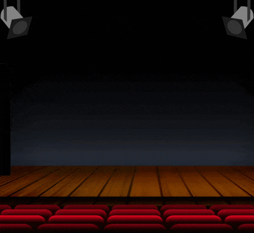a red sharpie marker is on a stage in front of red seats