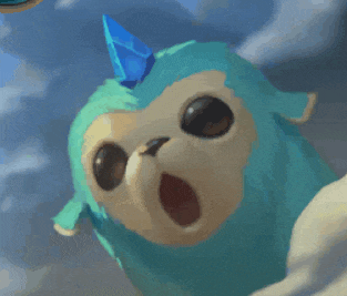 a blue stuffed animal with a blue horn on top of it