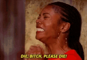 a woman in a red shirt is laughing and saying die bitch please die .