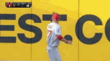 a baseball player with the number 27 on his jersey is running