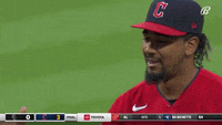 a baseball player wearing a hat that says c on it