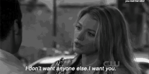 a black and white photo of a woman talking to a man with the caption i don t want anyone else i want you