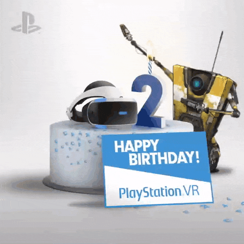 a birthday cake with a playstation vr headset on top of it