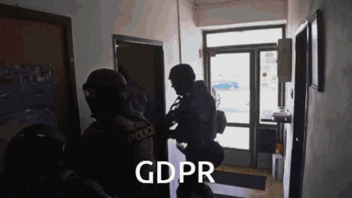 two police officers are standing in a hallway with gdpr written on the bottom right