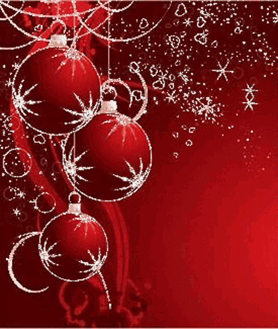 red christmas balls hanging on a red background with snowflakes