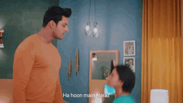 a man and a woman are looking at each other with the words ha hoon main naraz in the foreground