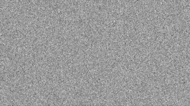 a close up of a gray background with a lot of small dots on it .